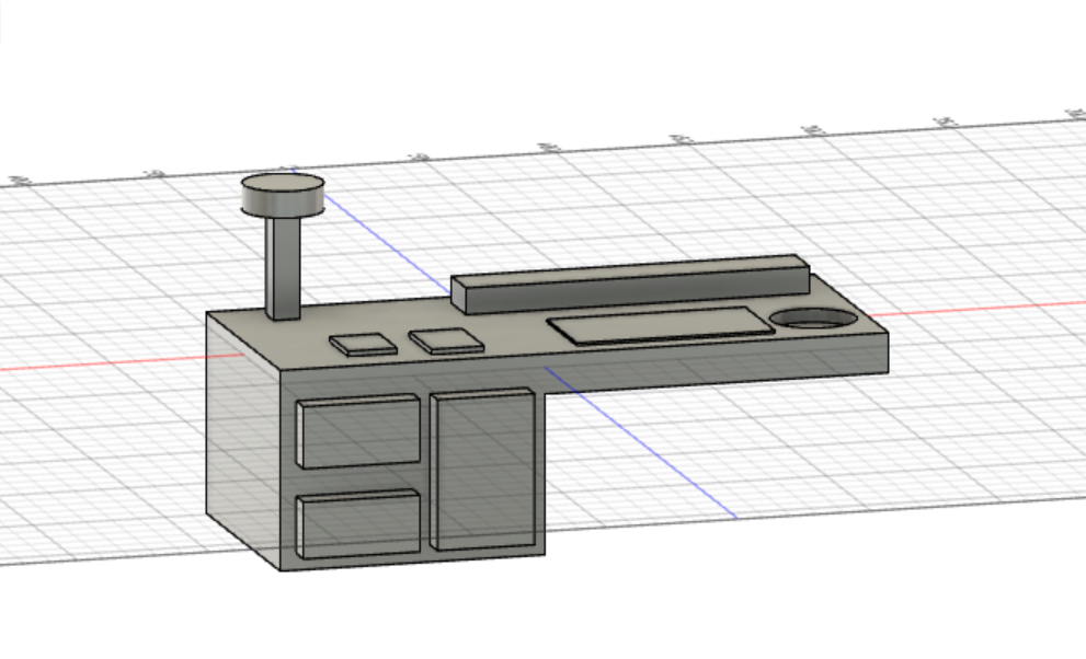 This image shows a 3D model of a desk. The desk has three drawers, a lamp, two books, a computer and some simple decorations.